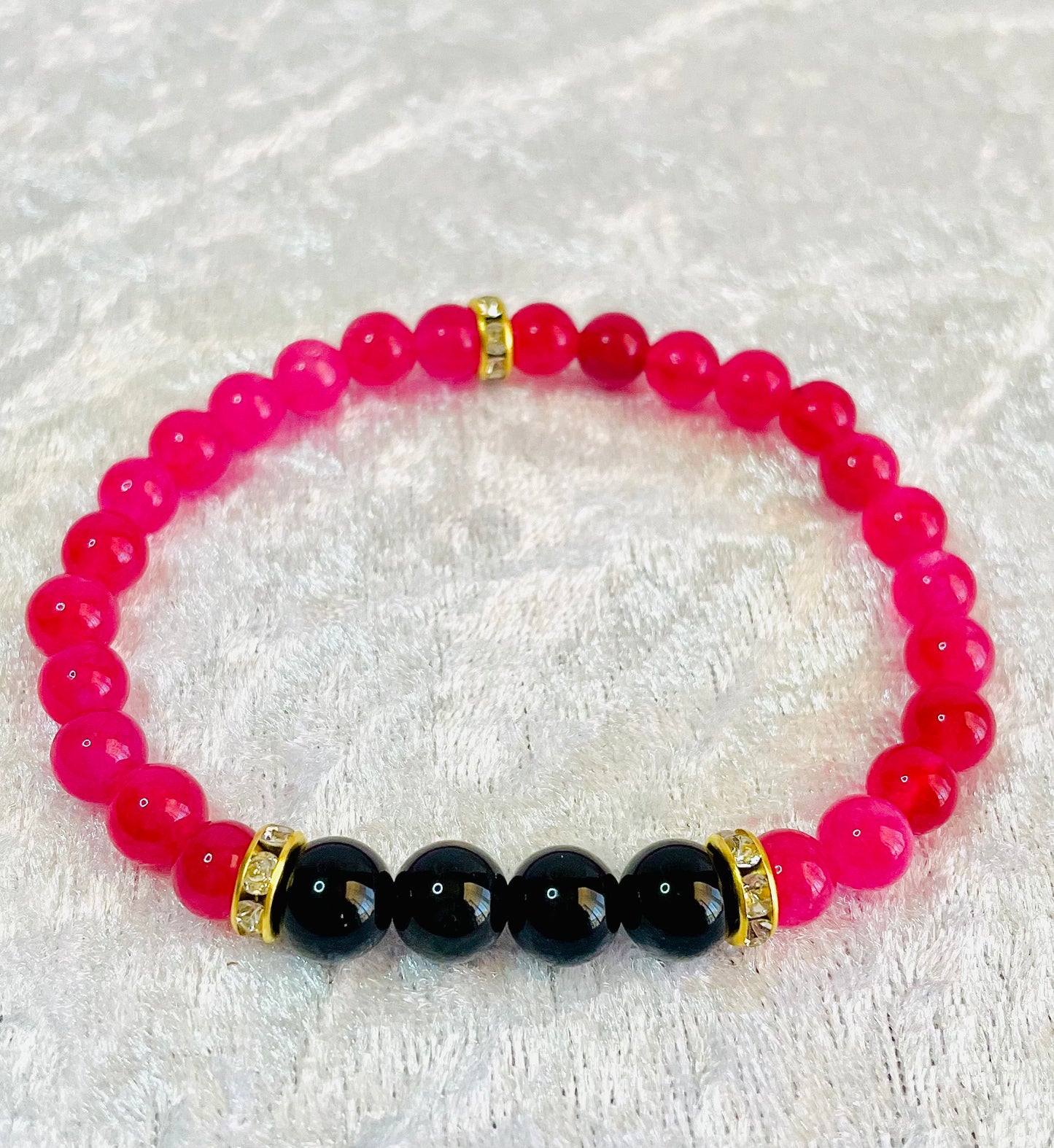 Rhodochrosite, black obsidian